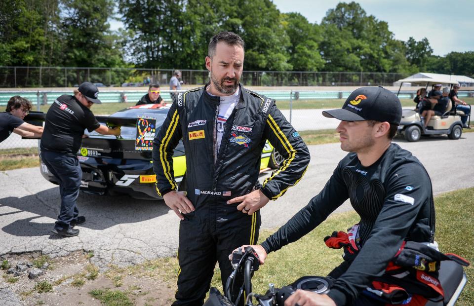 Trans Am Series driver Paul Menard, left, talks with Showtime Motorsports TA2 driver Cameron Lawrence at Road America in Elkhart Lake.