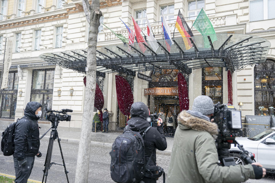 Journalists wait in front of the Grand Hotel Wien where closed-door nuclear talks with Iran take place in Vienna, Austria, Tuesday, April 6, 2021. Foreign ministry officials from the countries still in the accord, the so-called Joint Comprehensive Plan of Action, are meeting in Vienna to push forward efforts to bring the United States back into the 2015 deal on Iran's nuclear program. (AP Photo/Florian Schroetter)