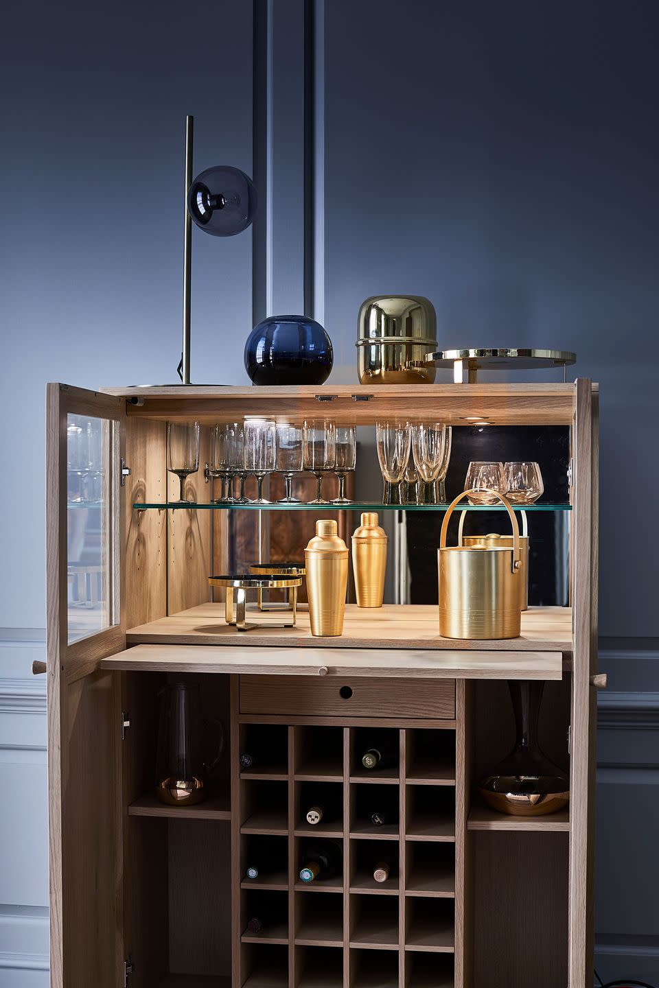 <p>Whether you love shaking cocktails, sipping wine or mixing shorts, this gold drinks cabinet is an excellent place to start. Sleek, stylish and contemporary, it has plenty of storage, a shelf for glasses and a spacious wine rack too. Get the party started...</p><p><a class="link " href="https://go.redirectingat.com?id=127X1599956&url=https%3A%2F%2Fwww.wayfair.co.uk%2F&sref=https%3A%2F%2Fwww.housebeautiful.com%2Fuk%2Flifestyle%2Fshopping%2Fg37511826%2Fwayfair-furniture%2F" rel="nofollow noopener" target="_blank" data-ylk="slk:SHOP NOW;elm:context_link;itc:0;sec:content-canvas">SHOP NOW</a></p>