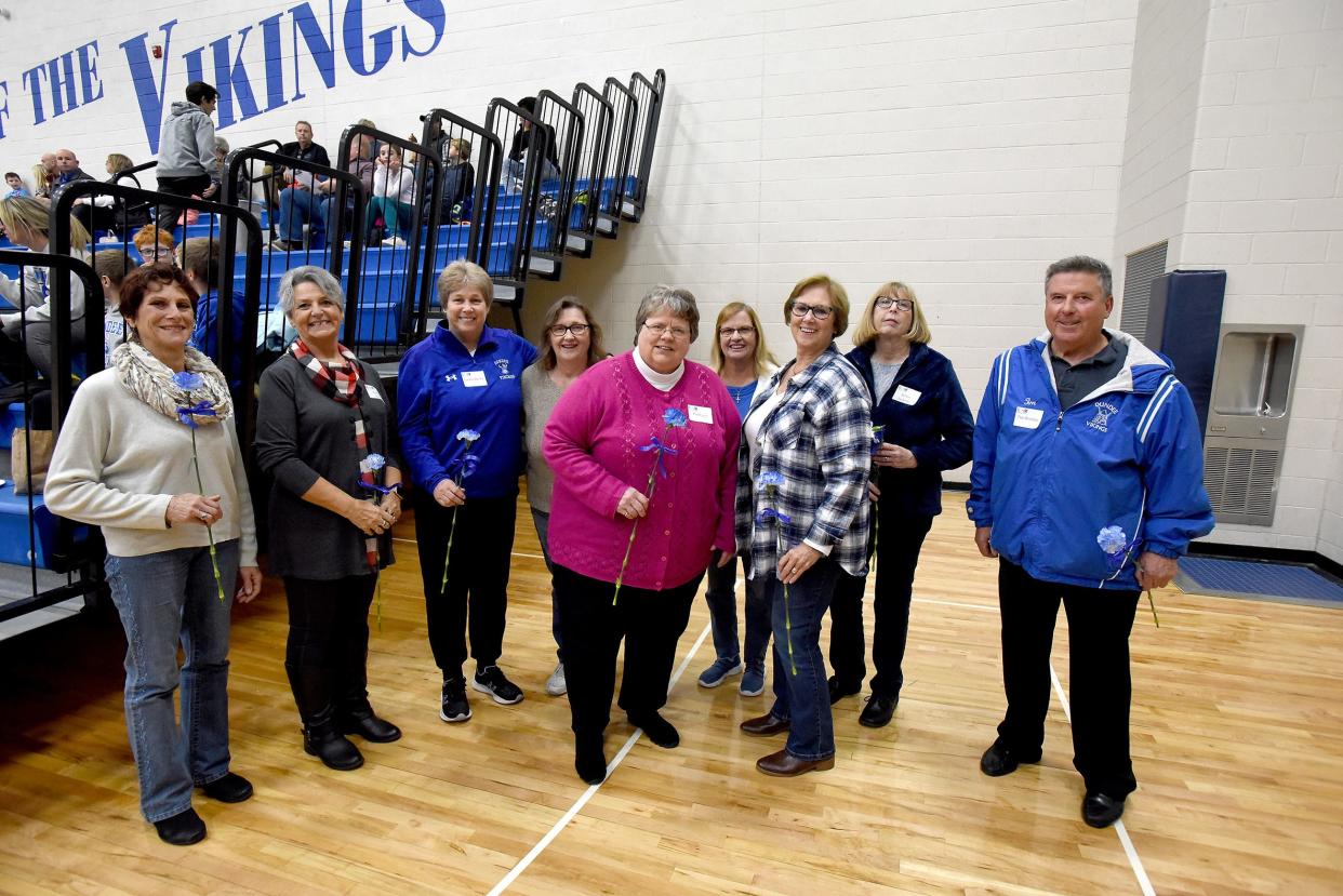 Wearing their name tags, with maiden names, are Dundee Viking athletes from 1972-73 Cindy Bowman, Antonia Welch, Luan Bunce, Betzy Bronson, Pat Rigel, Sharon Bunce, Valynda Schuler and Janice Juckette, who played sports for the first year of Title IX, along with Tim Bordine, who was on the first cross county team, were acknowledged this week at a home girls basketball game.