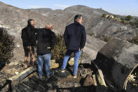 From left, L.A. Mayor Eric Garcetti, L.A. City Councilman Mike Bonin and California Governor Gavin Newsom view a burned home along Tigertail Road in Brentwood, Calif., Tuesday Oct. 29, 2019. (Wally Skalij/Los Angeles Times via AP, Pool)