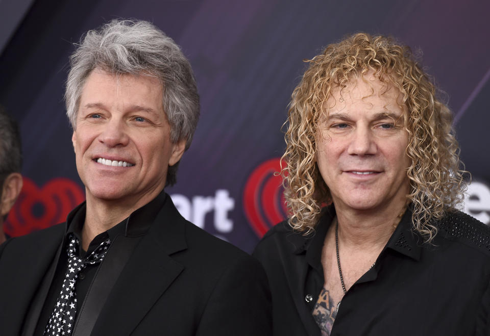 Jon Bon Jovi, left, and David Bryan, of Bon Jovi, arrive at the iHeartRadio Music Awards at The Forum on Sunday, March 11, 2018, in Inglewood, Calif. (Photo by Jordan Strauss/Invision/AP)