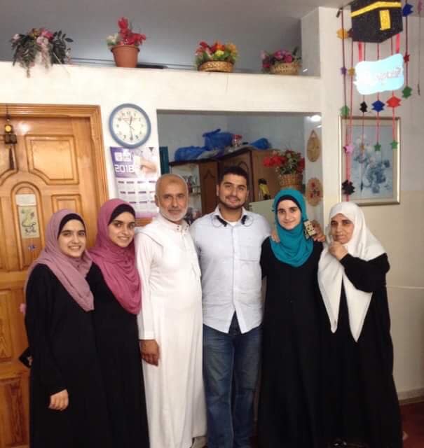 Yamaan Saadeh, center, with his father, stepmother and three sisters during a 2018 visit to Gaza. The Michigan neurosurgeon fears his family may not survive the ongoing war between Israel and Hamas and is hoping to get them to safety in the West Bank or even the U.S.