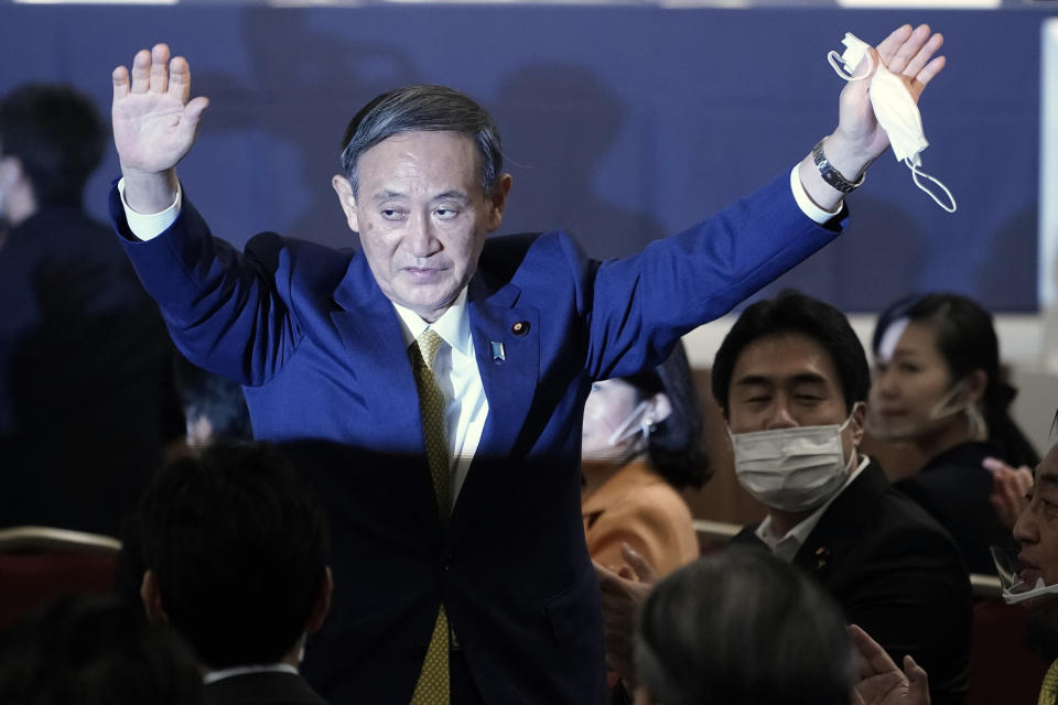 Japanese Chief Cabinet Secretary Yoshihide Suga acknowledges as he is elected as new head of Japan's ruling party at the Liberal Democratic Party's (LDP) leadership election Monday, Sept. 14, 2020, in Tokyo. The ruling LDP chooses its new leader in an internal vote to pick a successor to Prime Minister Shinzo Abe, who announced his intention to resign last month due to illness. (AP Photo/Eugene Hoshiko, Pool)