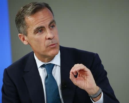 Mark Carney, Governor of the Bank of England, gestures during the session 'The BBC World Debate: A Richer World, but for Whom?' in the Swiss mountain resort of Davos January 23, 2015. REUTERS/Ruben Sprich