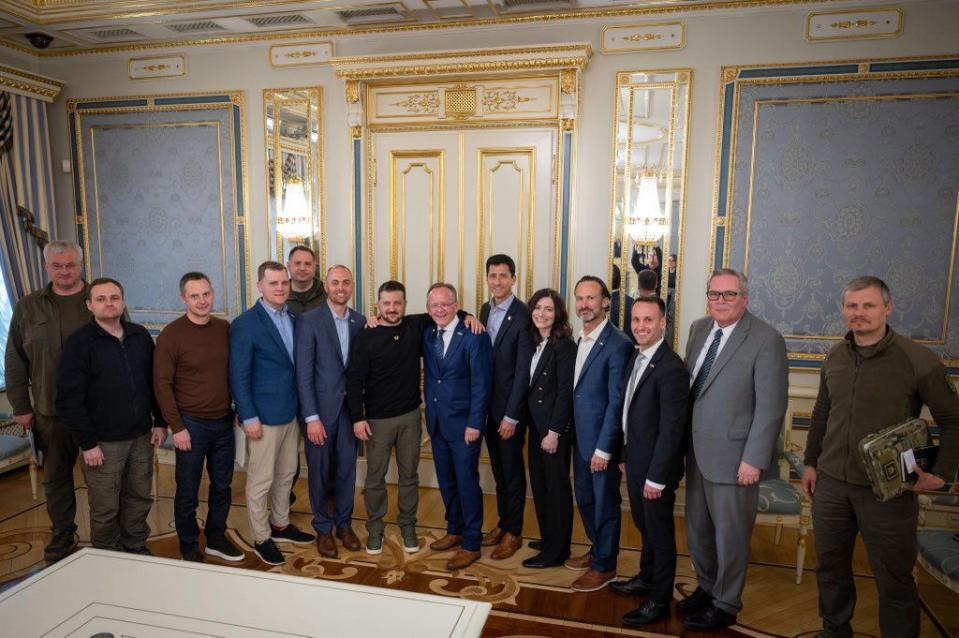 Ukrainian President Voldymyr Zelenskyy stands arm and arm with Utah Senate President Stuart Adams and the Utah delegation in Kyiv Saturday May 6, 2023.