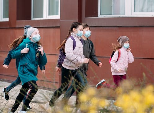   <span class="attribution"><a class="link " href="https://www.shutterstock.com/image-photo/children-students-medical-masks-leave-school-1720444717" rel="nofollow noopener" target="_blank" data-ylk="slk:David Tadevosian/Shutterstock;elm:context_link;itc:0;sec:content-canvas">David Tadevosian/Shutterstock</a></span>