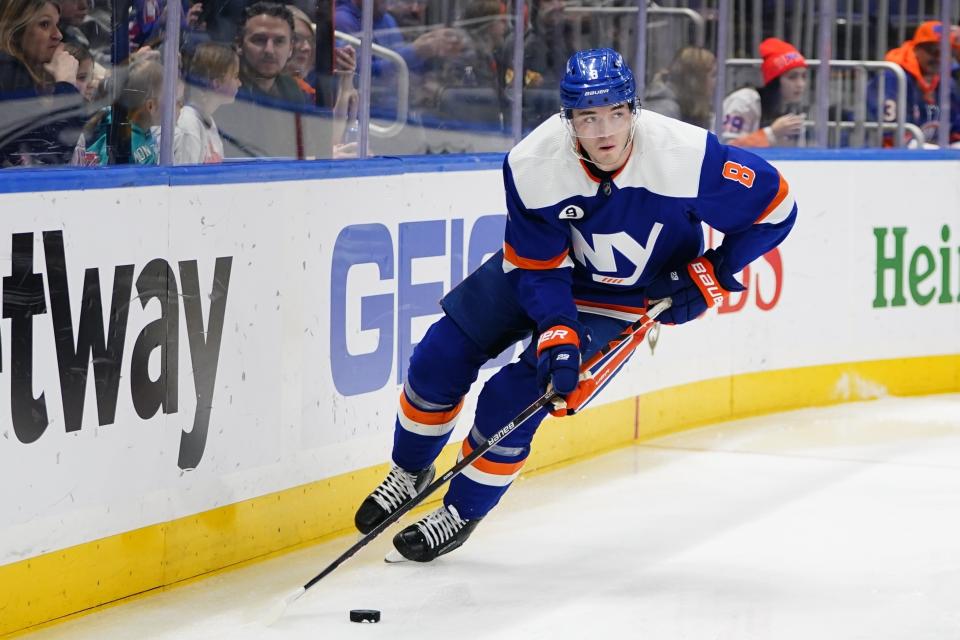 FILE - New York Islanders' Noah Dobson during the first period of an NHL hockey game against the St. Louis Blues, Saturday, March 5, 2022, in Elmont, N.Y. The New York Islanders have signed defensemen Noah Dobson and Alexander Romanov to three-year contracts. The Islanders also announced Monday, Aug. 22, 2022, the signing of forward Kieffer Bellows to a one-year deal.(AP Photo/Frank Franklin II, File)