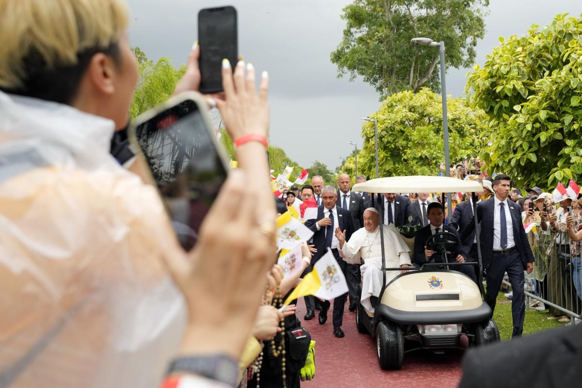 Pope lands in economic power Singapore after a joyous visit to impoverished, devout East Timor