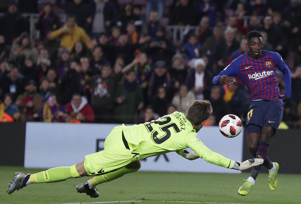 FC Barcelona's Dembele kicks the ball to score his side's second goal during a Spanish Copa del Rey soccer match between FC Barcelona and Levante at the Camp Nou stadium in Barcelona, Spain, Thursday, Jan. 17, 2019. (AP Photo/Manu Fernandez)