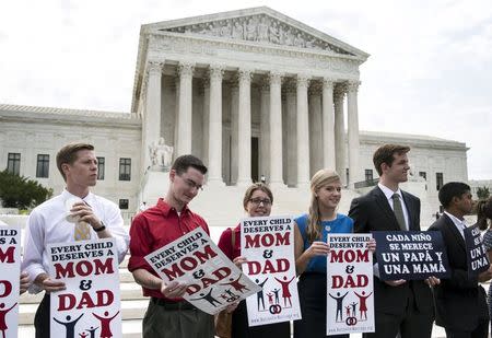 Protestors opposed to gay marriage rally in front of the Supreme Court in Washington June 25, 2015. REUTERS/Joshua Roberts