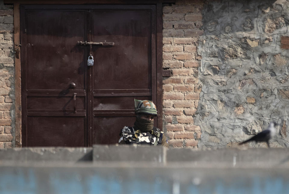 An Indian paramilitary soldier stands guard at a closed market area during a strike called by separatists in Srinagar, Indian controlled Kashmir, Saturday, Oct. 31, 2020. Kashmir’s main separatist grouping called the strike to protest new land laws that India enacted on Tuesday, allowing any of its nationals to buy land in the region. Pro-India politicians in Kashmir have also criticized the laws and accused India of putting Kashmir’s land up for sale. The move exacerbates concerns of Kashmiris and rights groups who see such measures as a settler-colonial project to change the Muslim-majority region’s demography. (AP Photo/Mukhtar Khan)