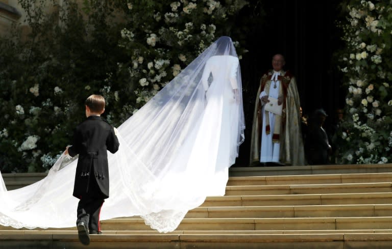 Meghan Markle wore a boat-necked, sculpted white wedding dress designed by Clare Waight Keller for French fashion house Givenchy