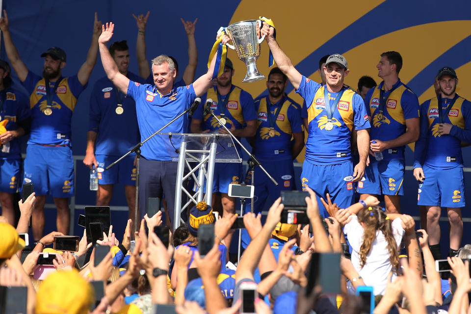 PERTH, AUSTRALIA - SEPTEMBER 30: Adam Simpson and Shannon Hurn show the premiership cup to the fans after winning yesterday's AFL Grand Final at Langley Park on September 30, 2018 in Perth, Australia. The West Coast Eagles beat the Collingwood Magpies 11.13 (79) to 11.8 (74).  (Photo by Paul Kane/Getty Images)