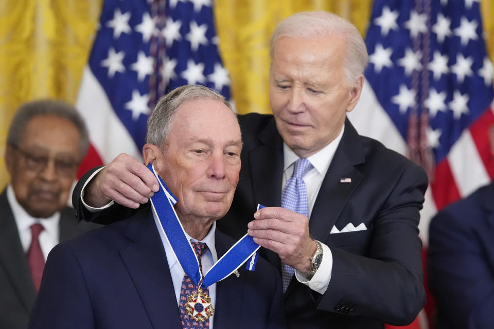 President Joe Biden awards the nation's highest civilian honor, the Presidential Medal of Freedom, to former New York City Michael Bloomberg during a ceremony in the East Room of the White House, Friday, May 3, 2024, in Washington. (AP Photo/Alex Brandon)