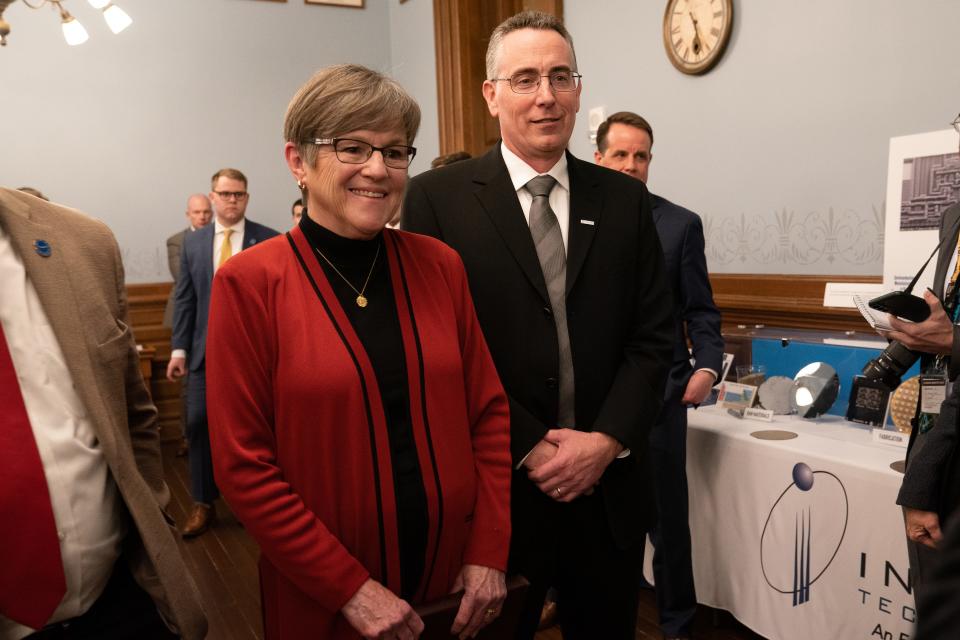 Gov. Laura Kelly poses alongside Integra President and CEO Brett Robinson after the announcement of an expansion of a semiconductor manufacturing plant in Wichita thanks to over $300 million in state incentives.