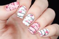 <p>Start with white or pink nails and then add scattered hearts. Top off the look with love letter decals.</p>