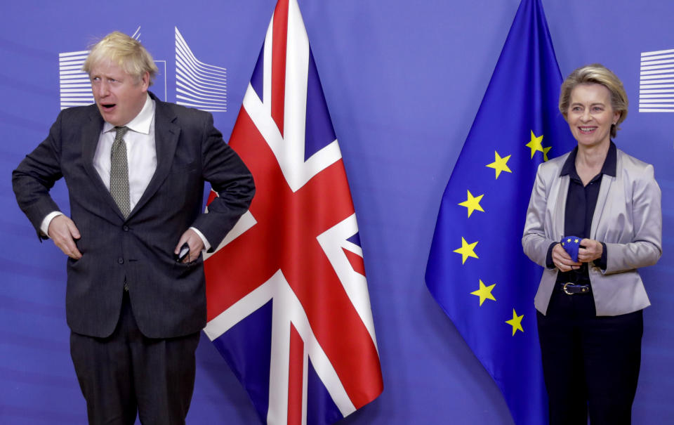 FILE - European Commission President Ursula von der Leyen, right, welcomes British Prime Minister Boris Johnson prior to a meeting at EU headquarters in Brussels, Dec. 9, 2020. After an acrimonious divorce and years of bickering, Britain’s government looks like it wants to make up with the European Union. European politicians and diplomats have noticed a marked softening of tone since Prime Minister Liz Truss took over from Boris Johnson as U.K. leader a month ago. (Olivier Hoslet, Pool via AP, file)