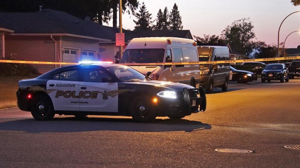 Abbotsford police block off the road outside the home where Kamaljit Sandhu was killed on July 28, 2022.