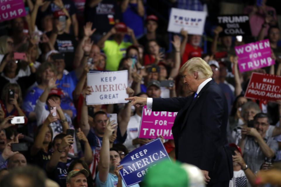 President Donald Trump points to a supporter after speaking during a rally Tuesday, Aug. 21, 2018, in Charleston, W.Va. (AP Photo/Alex Brandon)