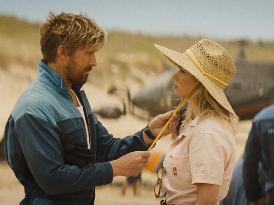 Ryan Gosling adjusting Emily Blunt's hat