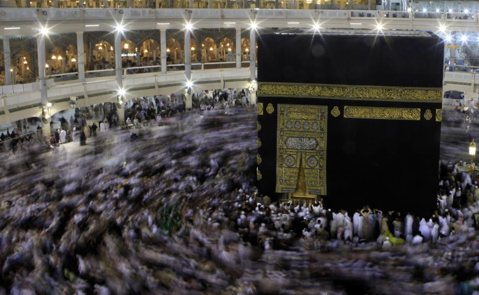 Muslims circle the Kaaba and pray during their Umrah Mawlid al-Nabawi pilgrimage, at the Grand Mosque in the holy city of Mecca