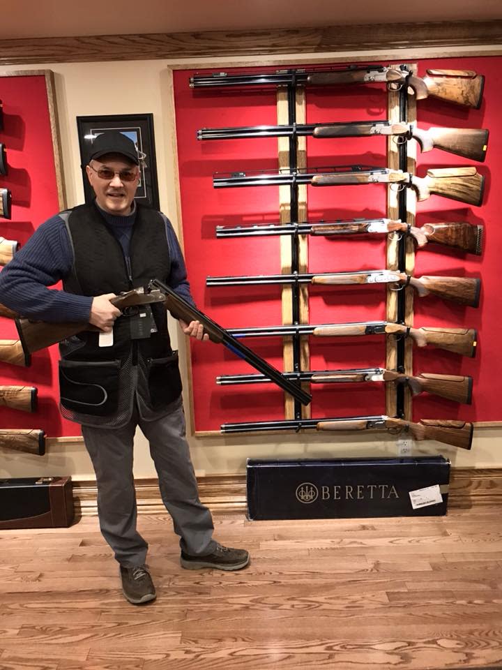 Ross Faulkner shows off some of the items at his gun shop in McAdam.