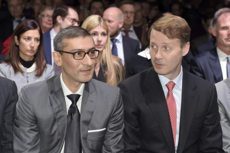 Chief executive of Nokia Rajeev Suri (L) and Chairman of the Board of Directors Risto Siilasmaa attend the Extraordinary General Meeting on December 2, 2015 in Helsinki, Finland