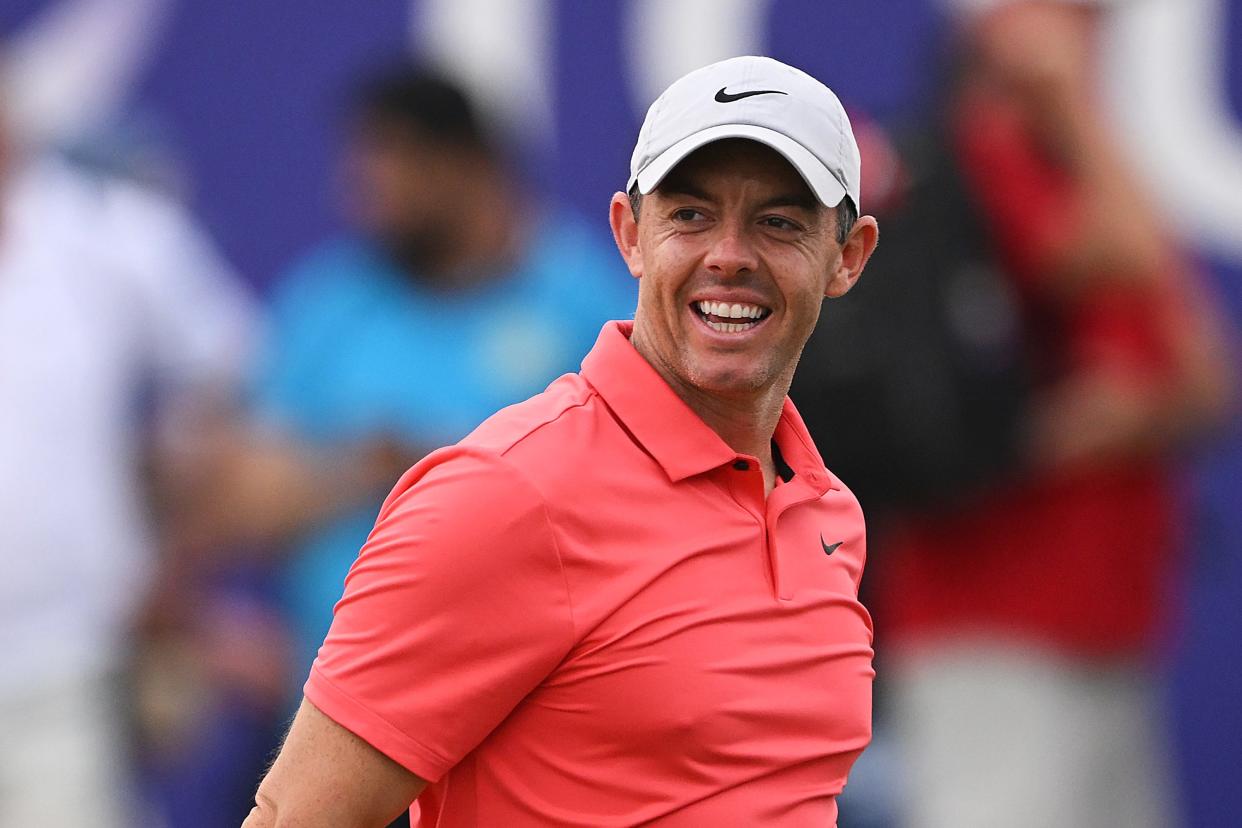 Rory McIlroy of Northern Ireland smiles whilst leaving the 18th green during Day One of the DP World Tour Championship on the Earth Course at Jumeirah Golf Estates on November 16, 2023 in Dubai, United Arab Emirates.