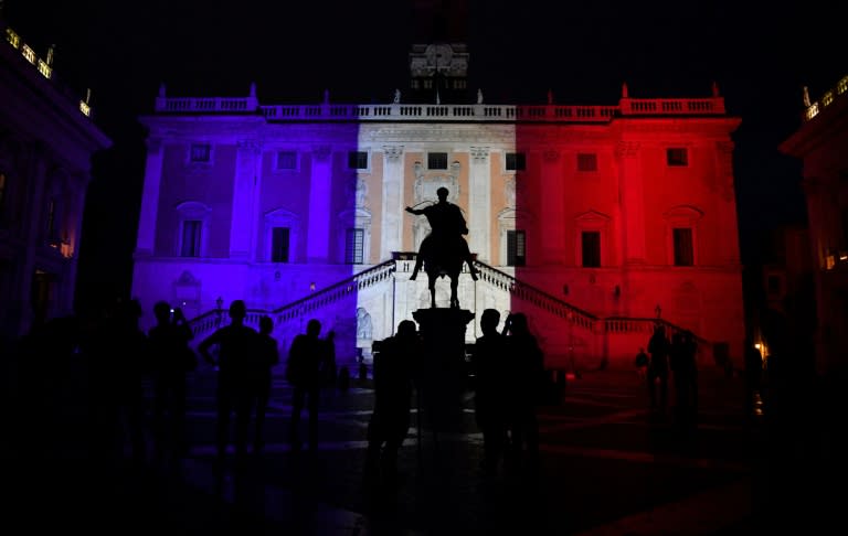 The colours of the French flag are projected on the Campidoglio in central Rome on July 15, 2016, in tribute to the victims after the deadly attacks in Nice