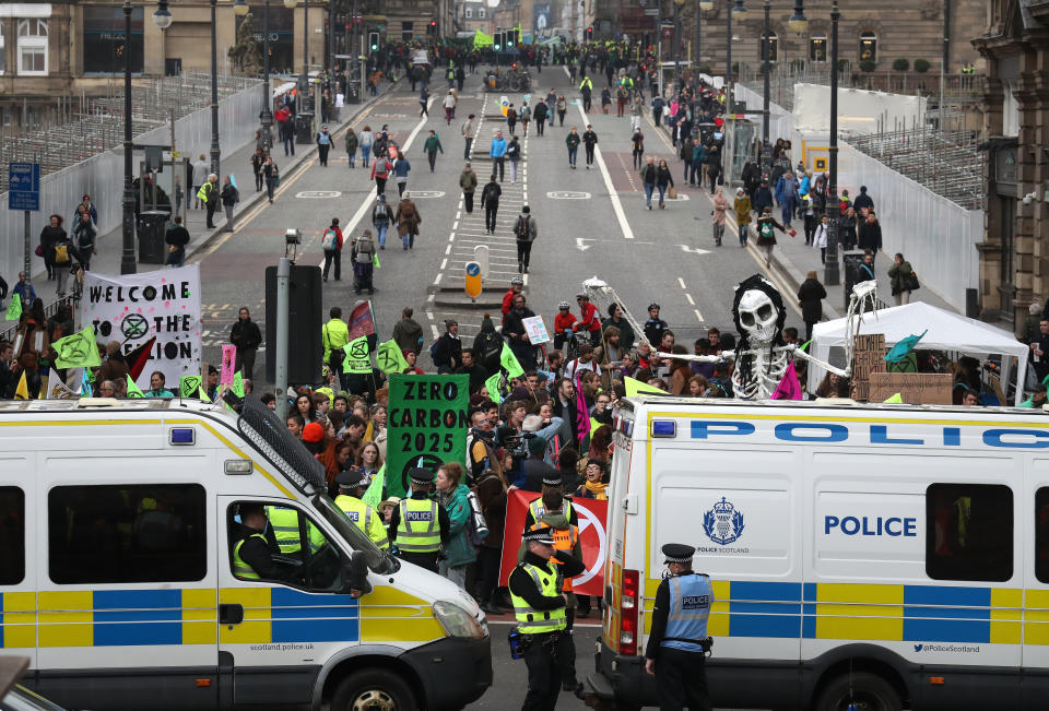 Climate protesters join Extinction Rebellion Scotland as they form a road block on the North Bridge in Edinburgh.