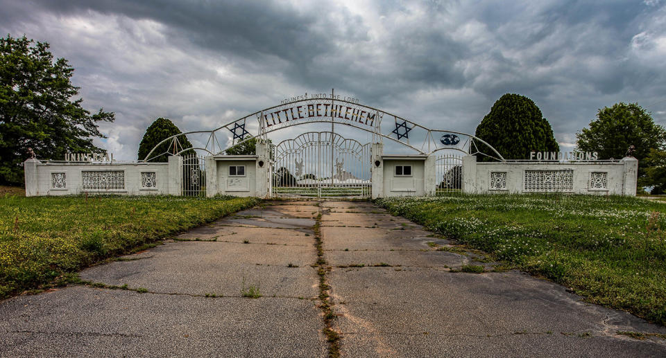 The gates to the complex were guarded in order to keep outsiders from prying into the affairs of the organisation. Source: Australscope/ Abandoned Southeast