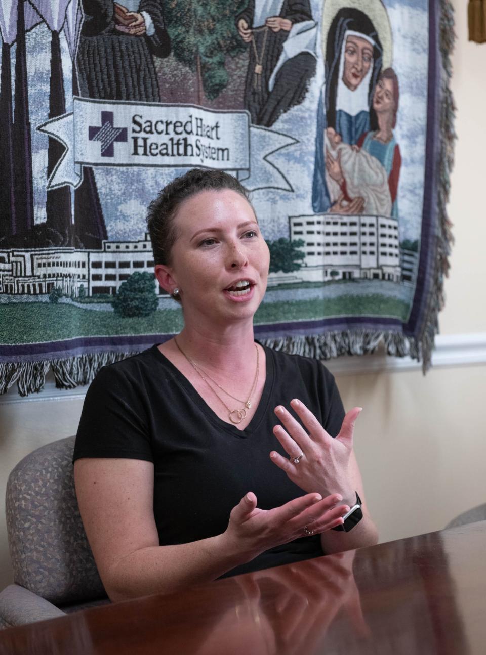 Whitney Burdick talks about her battle with breast cancer at Ascension Sacred Heart Hospital in Pensacola on Friday, Oct. 20, 2023.