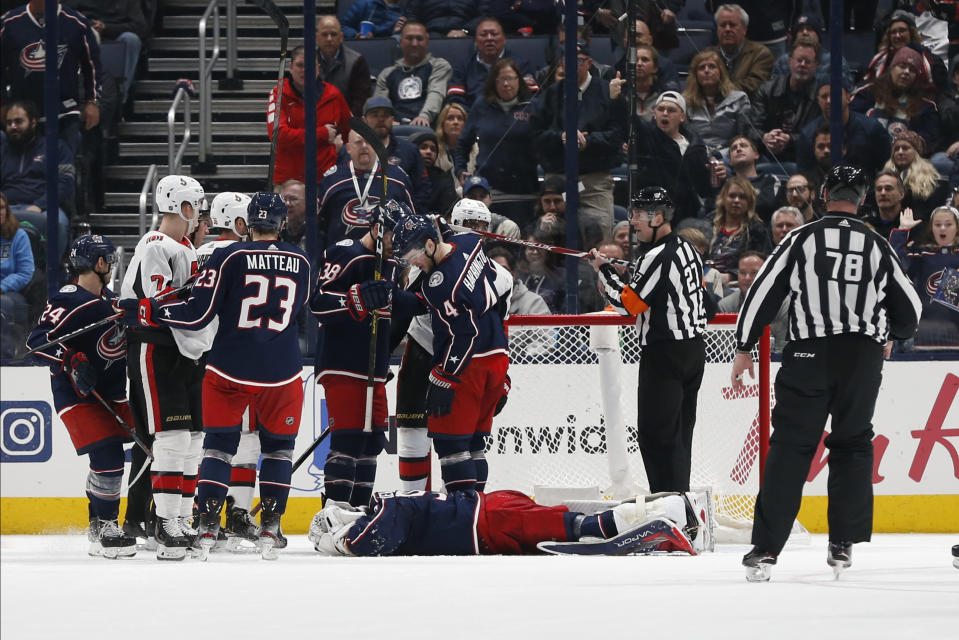 Columbus Blue Jackets' Elvis Merzlikins, of Latvia, lies on the ice after being injured during the second period of an NHL hockey game against the Ottawa Senators, Monday, Feb. 24, 2020, in Columbus, Ohio. (AP Photo/Jay LaPrete)