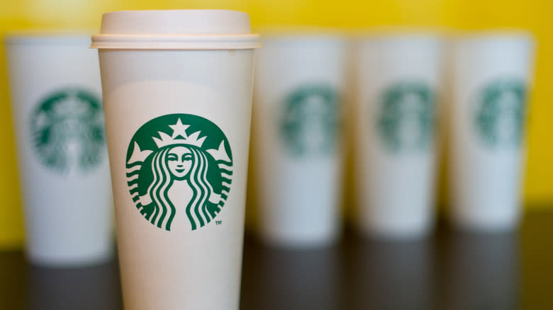 white Starbucks coffee cups