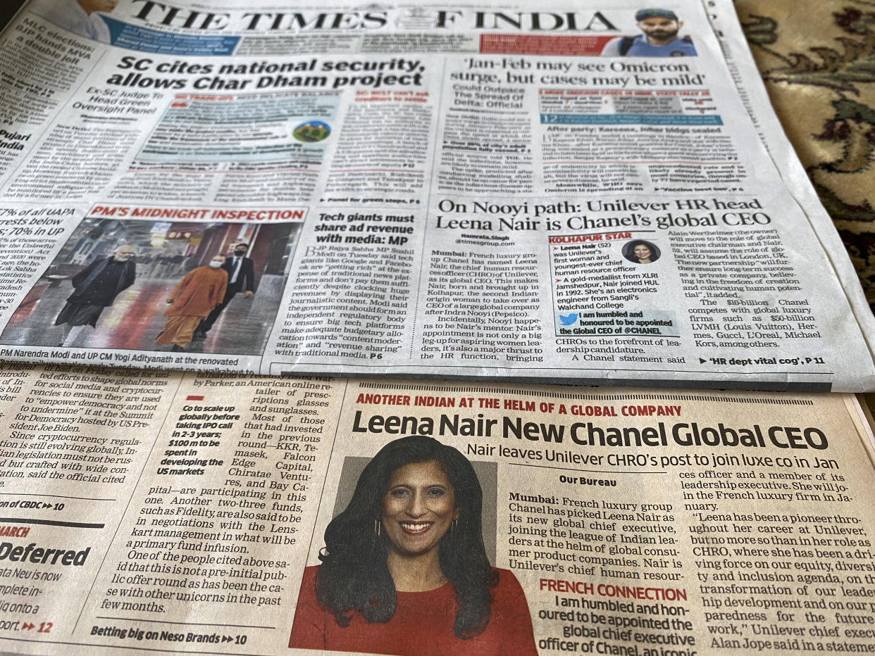 Two of the Indian newspapers that carried news of Unilever executive Leena Nair being chosen as the new CEO of luxury fashion house Chanel on their front page in Mumbai, India, Wednesday, Dec.15, 2021. (AP Photo/Rafiq Maqbool)