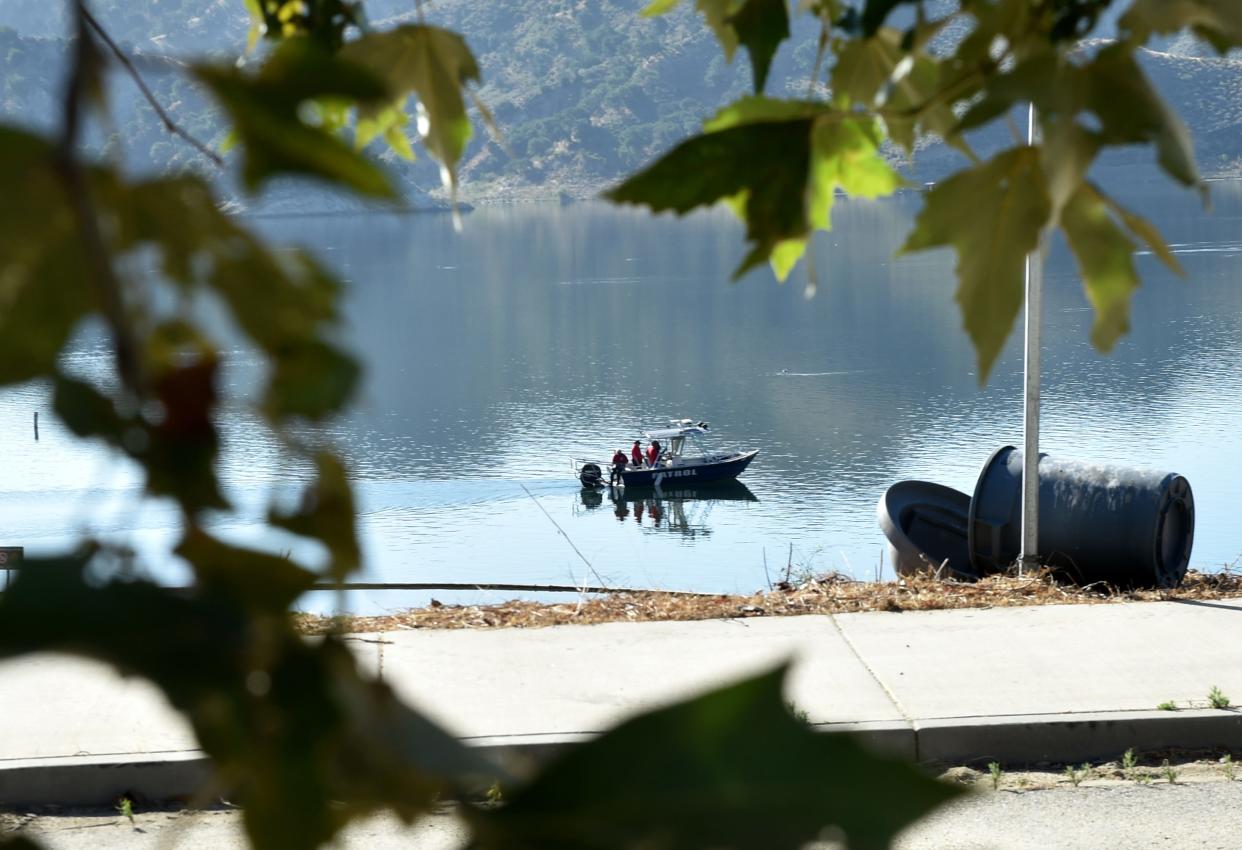Search-and-rescue teams use boats to look along the northern shore of Lake Piru on Thursday, July 9, 2020, for actress Naya Rivera. The "Glee" actress went missing after renting a boat with her 4-year-old son at Lake Piru on Wednesday.