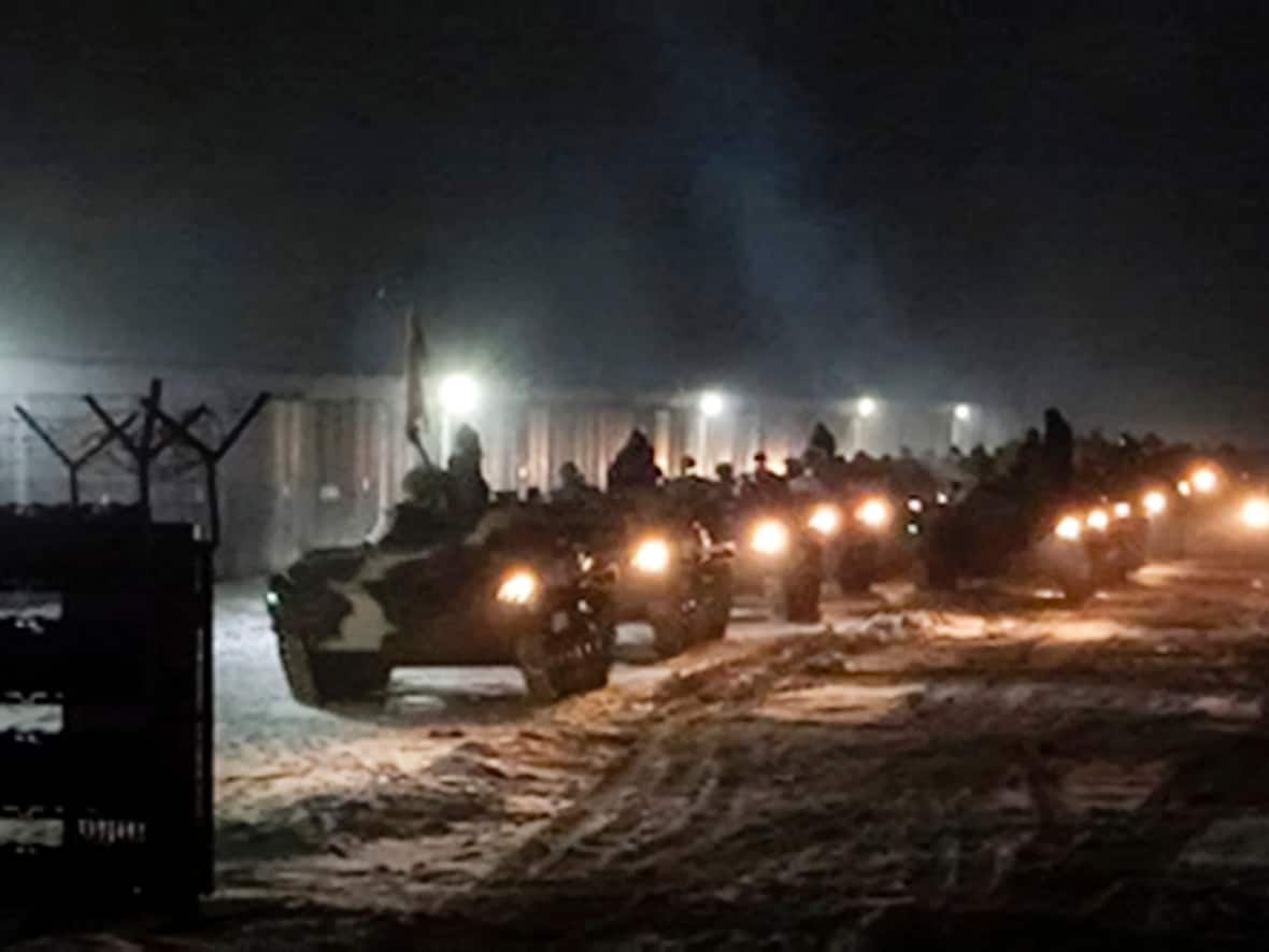 Belarusian military vehicles gather preparing to attend Belarusian and Russian joint military drills in Belarus on Tuesday, Jan. 25, 2022. Russia has sent an unspecified number of troops from the country's far east to its ally Belarus, which shares a border with Ukraine, for major war games next month. (Vayar Military Agency Agency via AP - image credit)