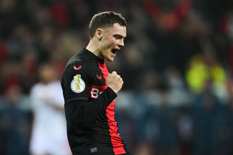 Leverkusen's Florian Wirtz celebrates scoring his side's third goal during the German DFB Cup semi final soccer match between Bayer Leverkusen and Fortuna Duesseldorf at BayArena. Marius Becker/dpa