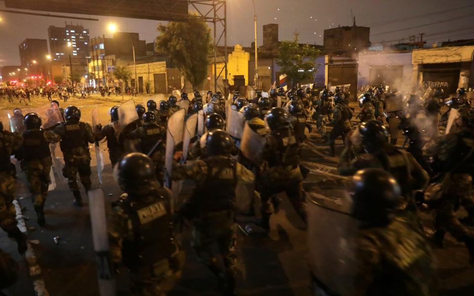 Demonstrators clash with police during protests that led to the resignation of Peru's interim President Manuel Merino - REUTERS