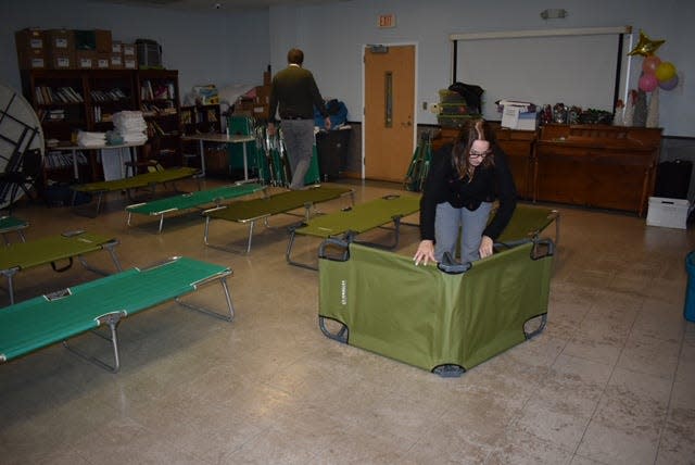 Gaston County Communications Director Adam Gaub and Special Project Admin Melanie Lowrance prepare beds for a cold weather shelter at the Salvation Army on South Broad Street on Wednesday, Jan. 17.