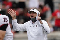 Georgia head coach Kirby Smart talks to his players before Georgia's spring NCAA college football game, Saturday, April 17, 2021, in Athens, Ga. (AP Photo/John Bazemore)