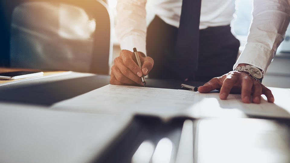 businessman writing or sketching