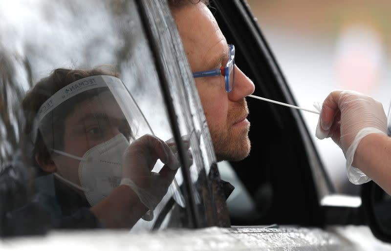 Founder of Express test Nick Markham has a swab taken at a new COVID-19 testing facility at Gatwick airport, amid the coronavirus disease (COVID-19) outbreak, in Crawley