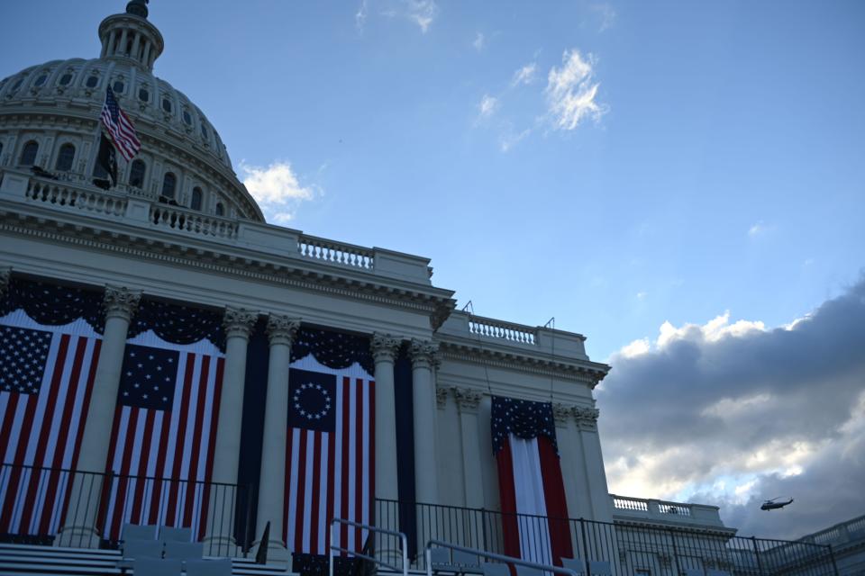 Marine One carrying outgoing President Donald Trump and First Lady Melania Trump flies past the U.S. Capitol decked out for the 59th presidential inauguration as they depart the White House in Washington, D.C., on January 20, 2021.