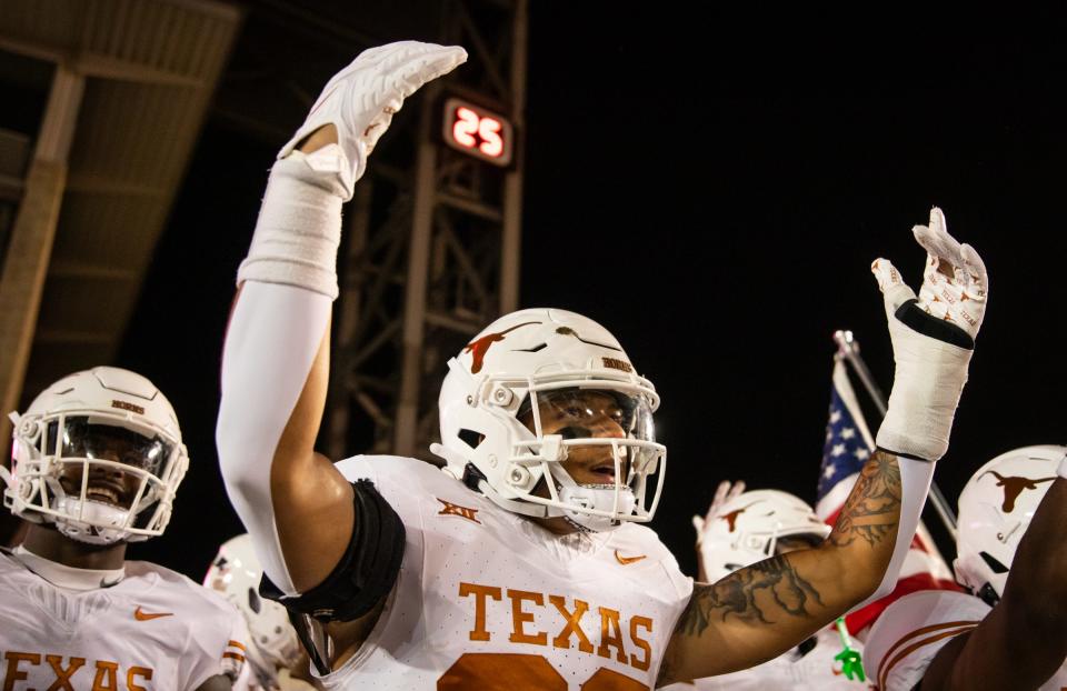 Texas defensive back Jerrin Thompson gets his teammates hyped as they prepare to take the field against Iowa State in November. Thompson entered his name into the transfer portal Friday, becoming the third safety to transfer out of the Texas program.