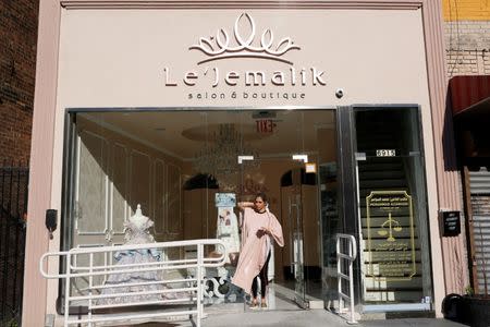 Farah Ibrahim, a 25 year old Palestinian American Muslim, stands outside Le'Jemalik Salon and Boutique after getting her hair dyed. REUTERS/Gabriela Bhaskar