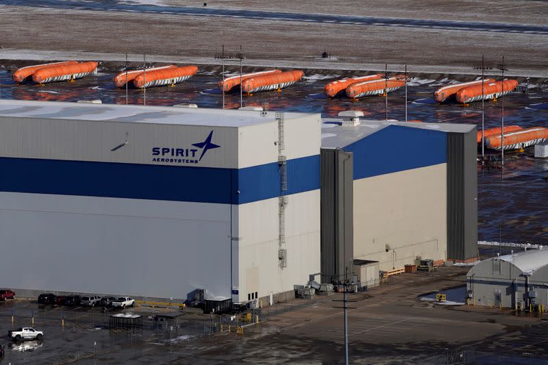 FILE PHOTO: Airplane fuselages bound for Boeing's 737 Max production facility sit in storage behind Spirit AeroSystems Holdings Inc headquarters, in Wichita