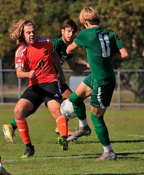 Flagler Palm Coast's Chase Magee (right) and Spruce Creek's Ryan Domon battle it out for the ball during the Five Start Conference Boys and Girls Soccer Tournament on Saturday, Jan.7th, 2023.