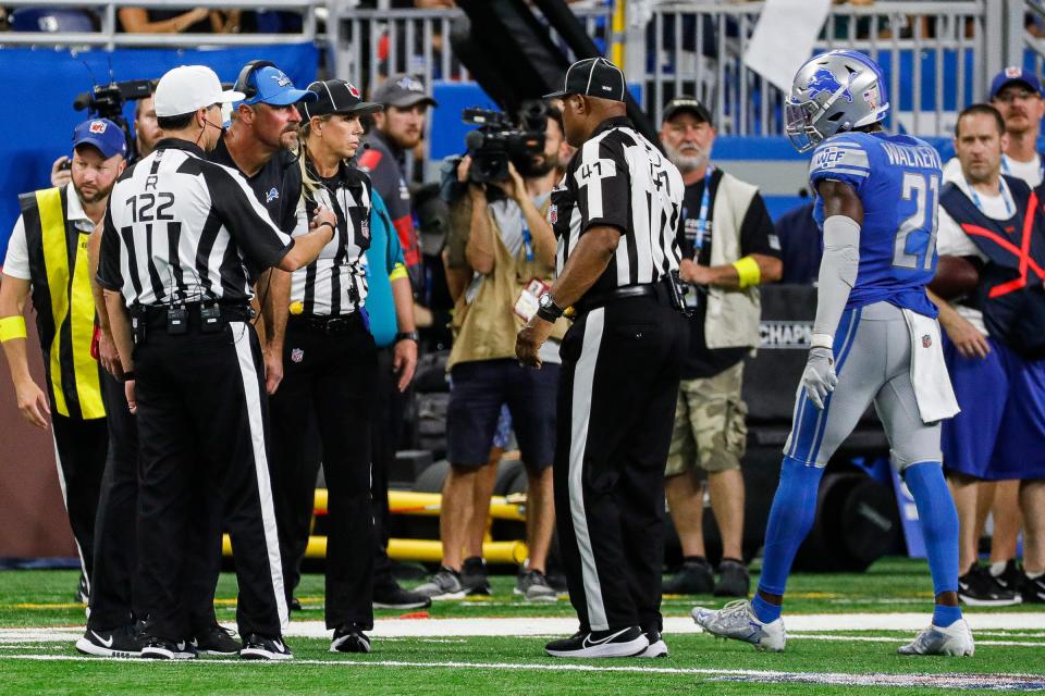 Detroit Lions head coach Dan Campbell talks to the referees as safety Tracy Walker III (21) is ejected from the game due to a penalty during the second half at Ford Field, Sept. 11, 2022.